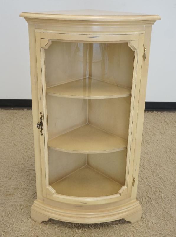 Sale Photo Thumbnail #211: 1210	1 DOOR CORNER CURVED GLASS CURIO CABINET WITH 2 INTERIOR SHELVES IN IVORY FINISH, APPROXIMATELY 24 IN X 17 IN X 44 IN H
