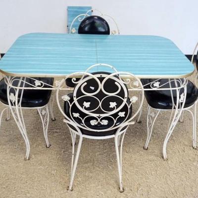 1256	VINTAGE WROUGHT IRON FORMICA TOP DINETTE SET, TABLE WITH LEAVE AND 4 CHAIRS, TABLE APPROXIMATELY 48 IN X 30 IN X 30 IN H, LEAF 12 IN
