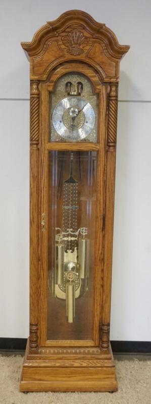 Sale Photo Thumbnail #197: 1196	OAK HOWARD MILLER GRANDFATHERS CLOCK *GLOCKENSPEIL* MODEL 610-766, APPROXIMATELY 24 IN X 14 IN X 87 N H
