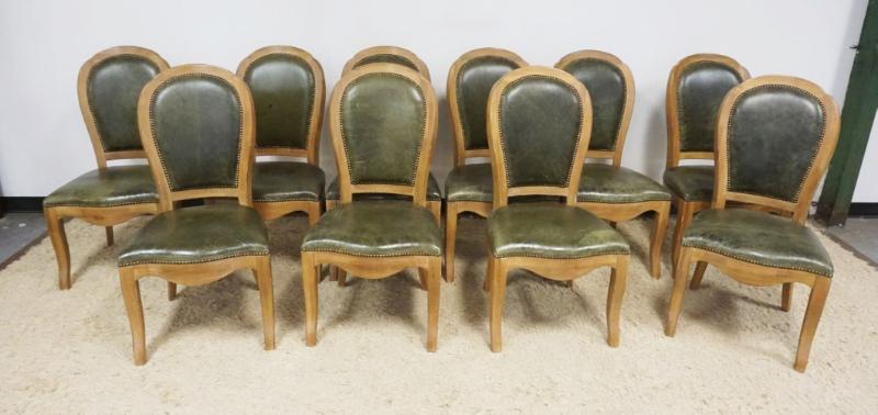Sale Photo Thumbnail #228: 1227	SET OF 10 OAK SIDE CHAIRS WITH GREEN LEATHER SEATS AND BACKS WITH BRASS TACK ACCENTS, EACH APPROXIMATELY 21 IN X 20 IN X 41 IN H
