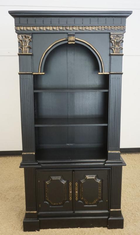 Sale Photo Thumbnail #202: 1201	2 PART NEO CLASSICAL STYLE BOOKCASE IN EBONIZED FINISH WITH REEDED COLUMN SIDES, ARCHED TOP AND 2 LOWER DOORS, APPROXIMATELY 39 IN X 16 IN X 79 IN H
