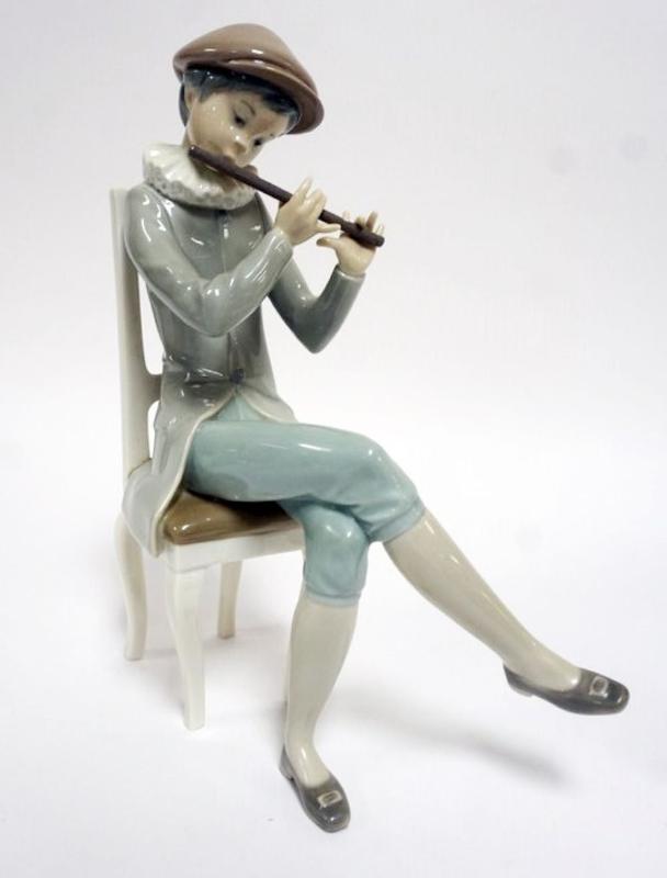 Sale Photo Thumbnail #62: 1062	LLADRO PORCELAIN FIGURE *BOY WITH FLUTE* APPROXIMATELY 10 IN HIGH
