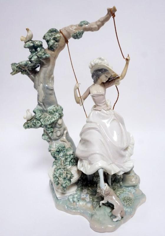 Sale Photo Thumbnail #75: 1075	LLADRO PORCELAIN FIGURE *VICTORIAN GIRL ON SWING* ROPE SEPARATED ON RIGHT SIDE, APPROXIMATELY 17 IN HIGH
