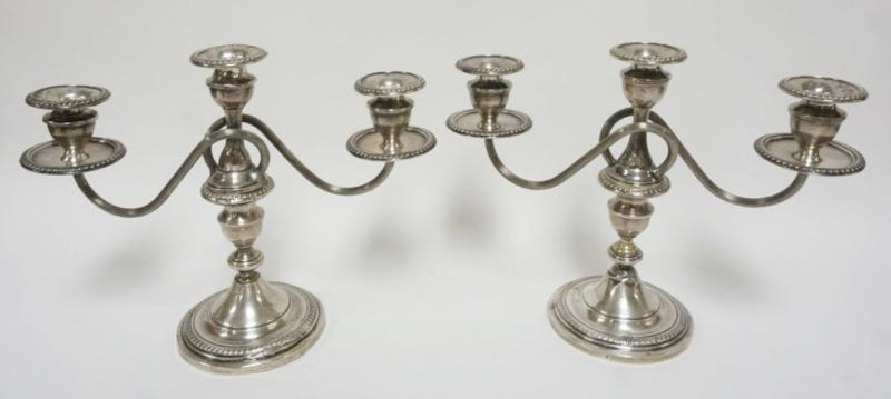 Sale Photo Thumbnail #95: 1095	PAIR OF STERLING SILVER WEIGHTED CANDELABRA, EACH APPROXIMATELY 10 IN H

