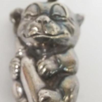 1094	STERLING SILVER PUPPY HUGGING A BOTTLE BABY RATTLE, .67 OZT
