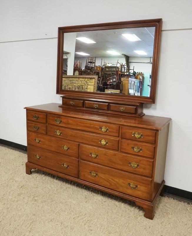 Sale Photo Thumbnail #272: 1271	HENKEL HARRIS VIRGINIA GALLERIES SOLID BLACK CHERRY CHEST OF DRAWERS WITH MIRROR, 13 DRAWERS, CHEST APPROXIMATELY 66 IN X 29 IN X 35 IN H, MIRROR APPROXIMATELY 53 IN X 35 IN
