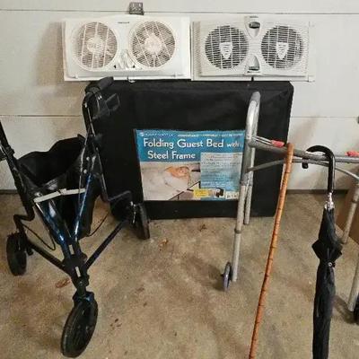 Sleep Master Folding Guest Bed, Honeywell Window Fan, and Walkers