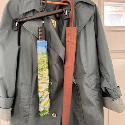 Lot 136:  Coat And Umbrellas 