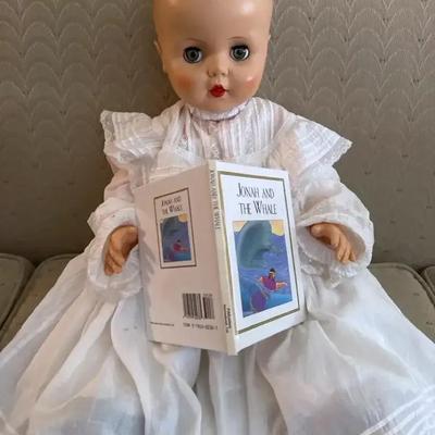 Lot 122:  Vintage Baby Doll in Christening Gown with “Jonah and the Whale” Book and Clothing 