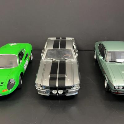 3 Model Cars With Display Case