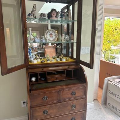 desk with glass-front hutch