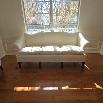 Chippendale-style camelback sofa with rolled arms