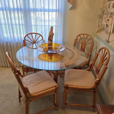 Sale Photo Thumbnail #46: Vintage rattan table w/ 4 chairs. Glass top.