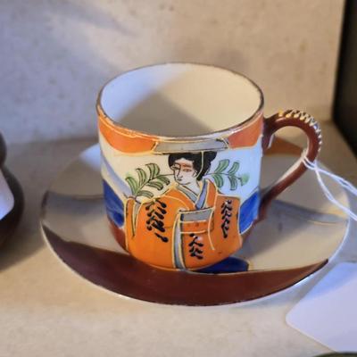 Vintage porcelain oriental cup and saucer