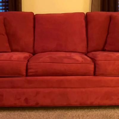 Cindy Crawford Burnt Orange Sleeper Sofa with Matching Pillows