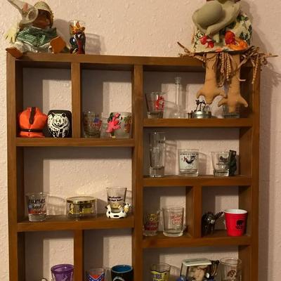 Wooden Display Shelf with Collectible Shot Glasses and Musical Wind-Up
