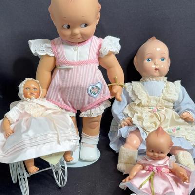 Assorted Collectible Dolls and Carriage