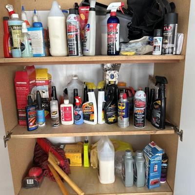 Garage shelf with motor oil, car wax, and automotive detail supplies