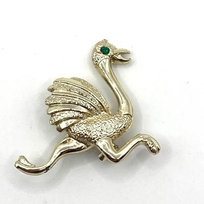 Vintage Gerry'S Gold-Tone Ostrich Brooch With Green Eyes