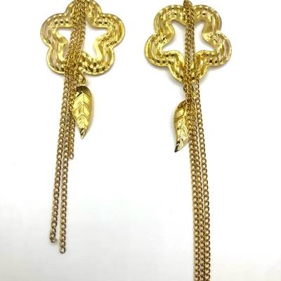 Gold-Tone Statement Earring With A Flower-Shaped Stud, A Leaf Charm, And Multiple Chain Tassels.