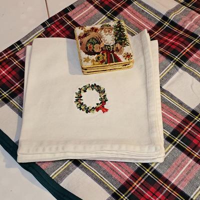 Lot #135 - Holiday Table Linens & Needlepoint Santa Coasters – Plaid Tablecloth and Wreath Napkins