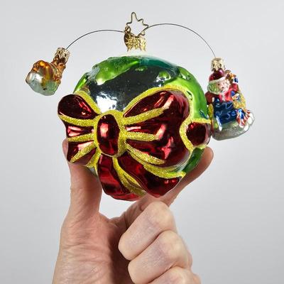 Lot #62 - Four Vintage Glass Kerr-McGee "Around the World" Globe Ornaments with Santa's Sleigh and Reindeer Accents