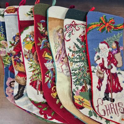 Lot #106 - Vintage Needlepoint Christmas Stockings – Handcrafted Holiday Mantel Decor (Set of 7)