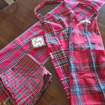 Lot #138 - Williams Sonoma Red Plaid Aprons, Plus Napkins, Table Runner & Coasters