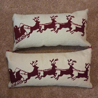Lot #149 - Pair of Christmas Lumbar Pillows – Santa Sleigh and Reindeer Hooked Design With Bells