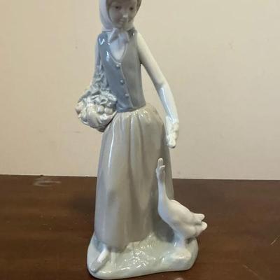Vintage Lladro Nao woman feeding a goose porcelain figurine