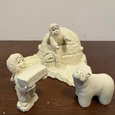 Department 56 "Snowbabies" figurine set titled "We're Building an Icy Igloo”