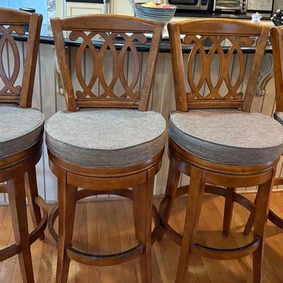 Four High Back Swivel Cushioned Seat Barstools 
