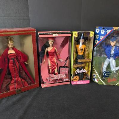 4 New In Pack Barbie Dolls