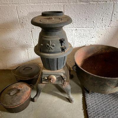 053-CEL: Cast-Iron Parlor Stove, Extra Large Pot, and Kettles