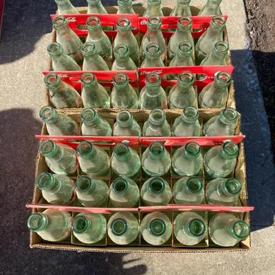 4 Boxes Of Coke Bottles
