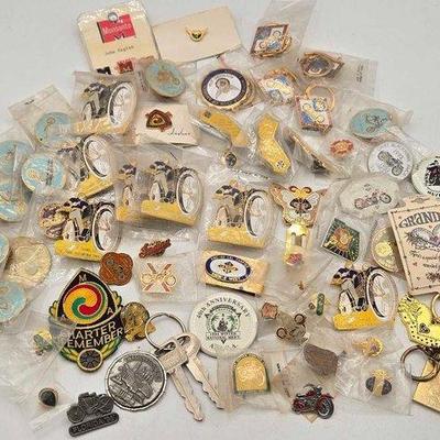 2184 • assortment of pins and keychains