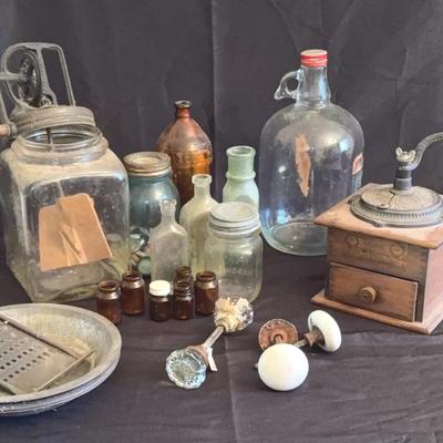 Vintage Butter Churn, Coffee Grinder, Assorted Bottles, And Door Knobs