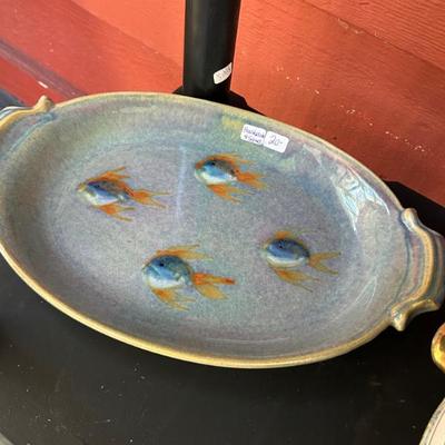 Handmade pottery piece with handles. Signed. 