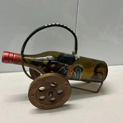 Sale Photo Thumbnail #324: Vintage Swedish brass and wood 1970's wine bottle holder. 