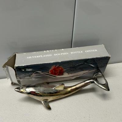 Sale Photo Thumbnail #300: Silver plated dolphin bottle opener. 