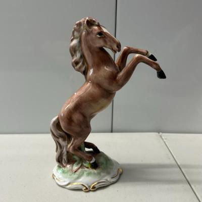 Sale Photo Thumbnail #117: Vintage Italian hand painted porcelain horse in rearing position.  