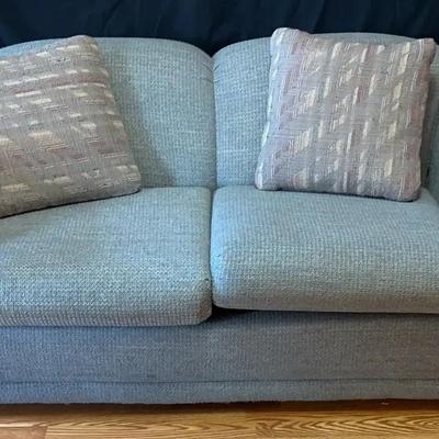 Light Blue Upholstered Sofa with Accent Pillows