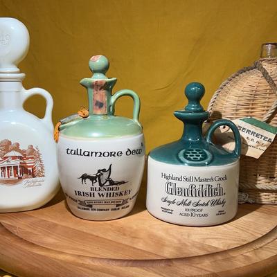 Collection of vintage Irish and Scotch whisky ceramic decanters