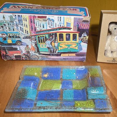 Avon Cable Car aftershave bottle, Steiff Club teddy bear and ash tray