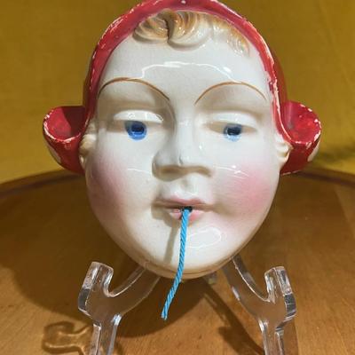 Vintage chalkware girl head string holder with red cap, made in Japan