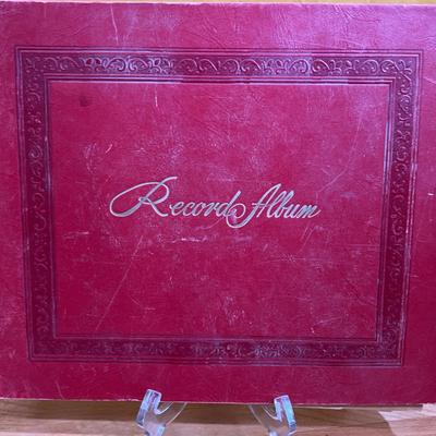 Vintage red Record Album with record collection inside 
