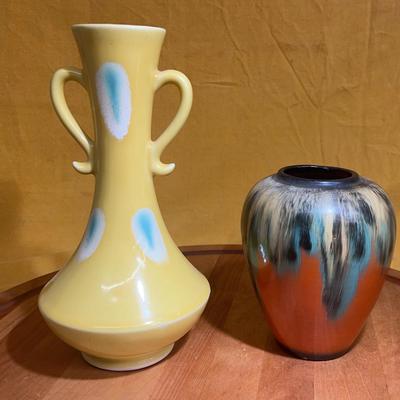Pair of mid-century decorative ceramic vases, one yellow with blue spots, one drip glazed