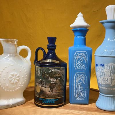 Collection of decorative liqueur and glass bottles