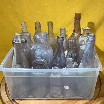 Collection of assorted antique glass bottles