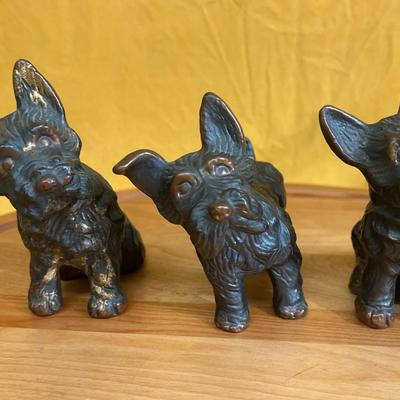 Set of 3 Scottish Terrier figurines, likely resin with metallic finish